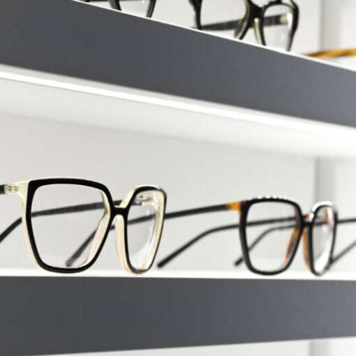 Stylish design glasses on shelves in a shop