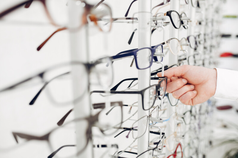 Man in a glasses. Guy in a optics shop